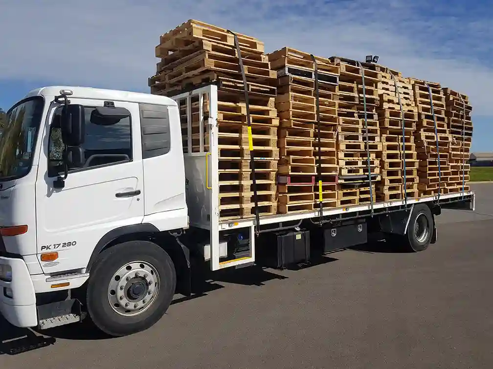 Stack of high-quality recycled pallet wood for sale in Edmonton warehouse